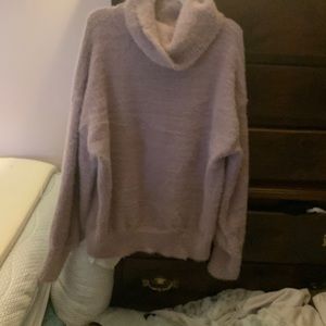 An adorable fuzzy sweater. Lightweight but toasty
